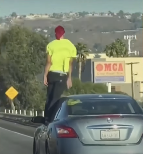 Wild Video Shows Driver Standing Up Outside His Car While Driving on Freeway