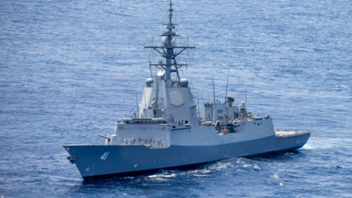 Destroyer HMAS Brisbane saves capsized yachties after 15-hour ordeal off Wollongong