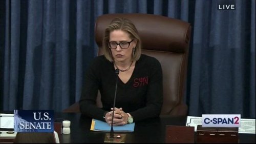 Sen. Kyrsten Sinema (D-AZ) is really embracing her devilish side while presiding over the Senate today.