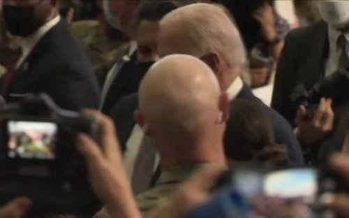 President Biden snaps a bunch of selfies with U.S. Air Force personnel and their families.