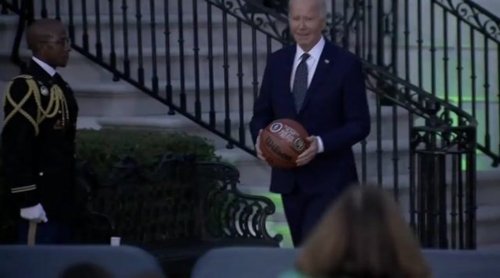 Joe Biden has some fun with a basketball after honoring the Celtics' champsionship at the White House.