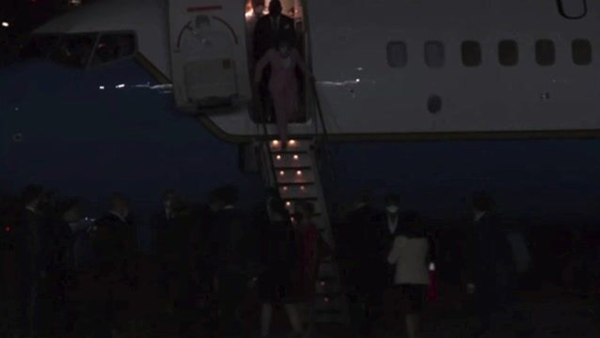 House Speaker Nancy Pelosi walks off the plane after touching down in Taiwan.