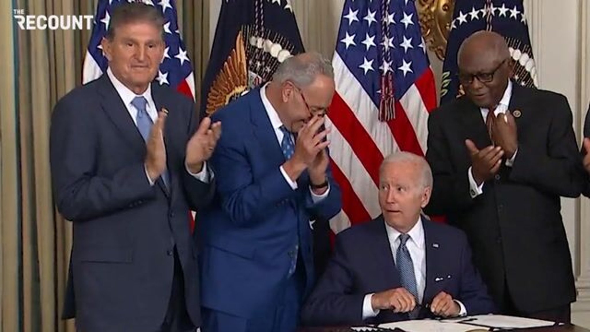 President Biden hands the sole pen he used to sign the Inflation Reduction Act to Sen. Joe Manchin (D-WV).