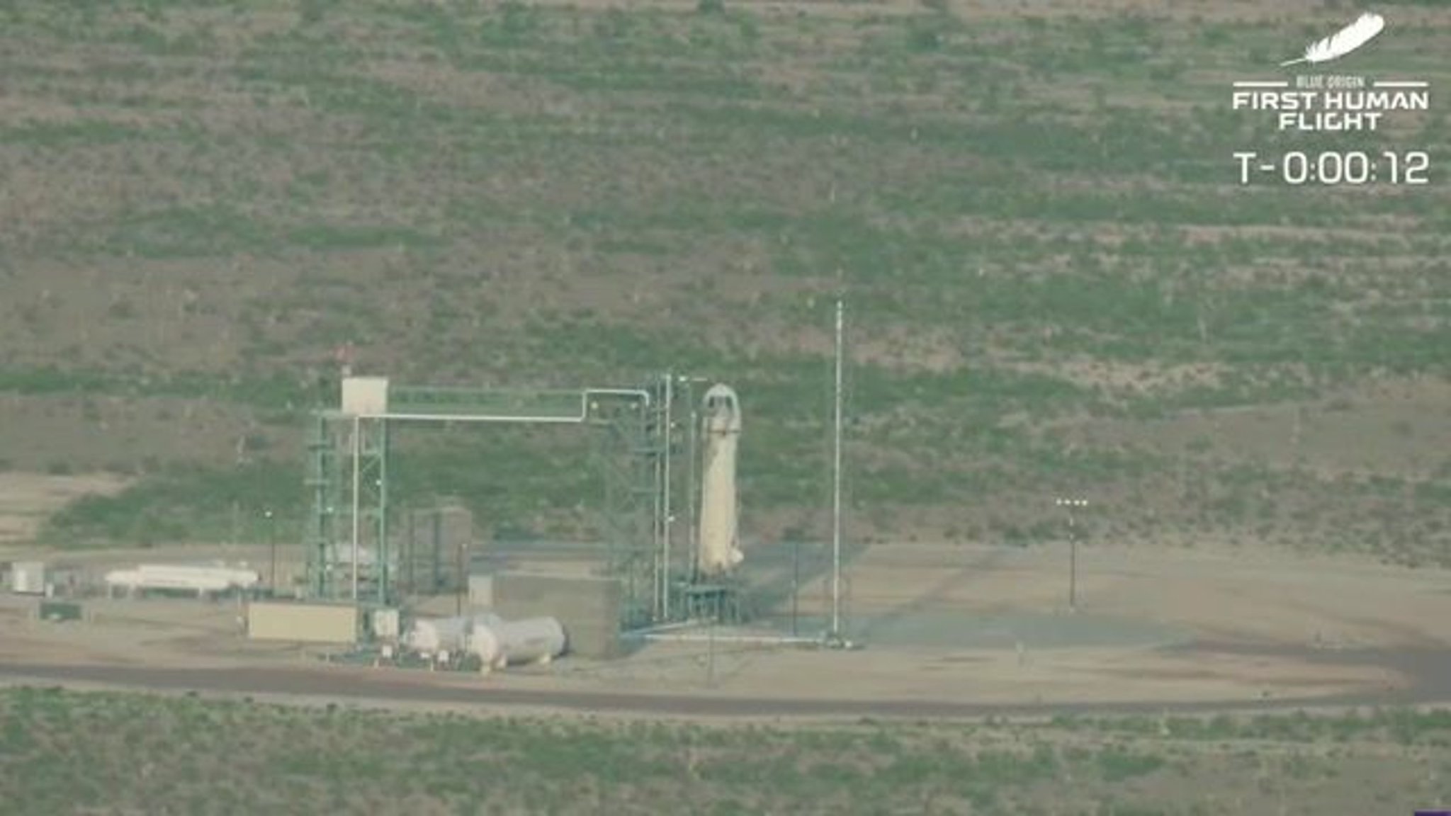 Blue Origin rocket launches for flight to the edge of space with Amazon founder Jeff Bezos and his brother Mark Bezos.