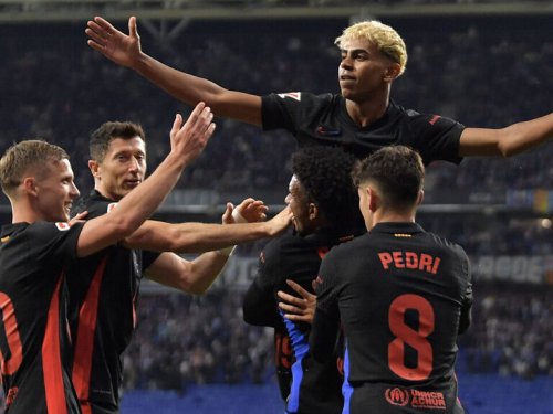 Barca win La Liga title to seal domestic treble
