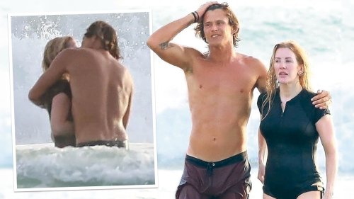 Ellie Goulding kisses young surfing instructor while husband Caspar remains home