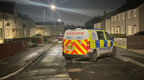 Man rushed to hospital after 'gunman shoots through front door' of Scots home