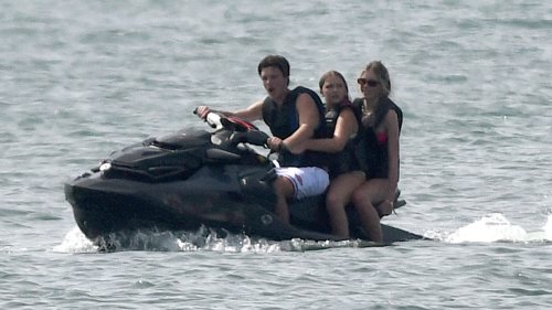 David and Victoria Beckham watch on while Harper, 11, zips around on a jetski