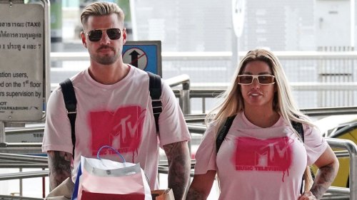 Katie Price and Carl Woods wear matching t-shirts as they arrive at Thailand airport after she swerved jail