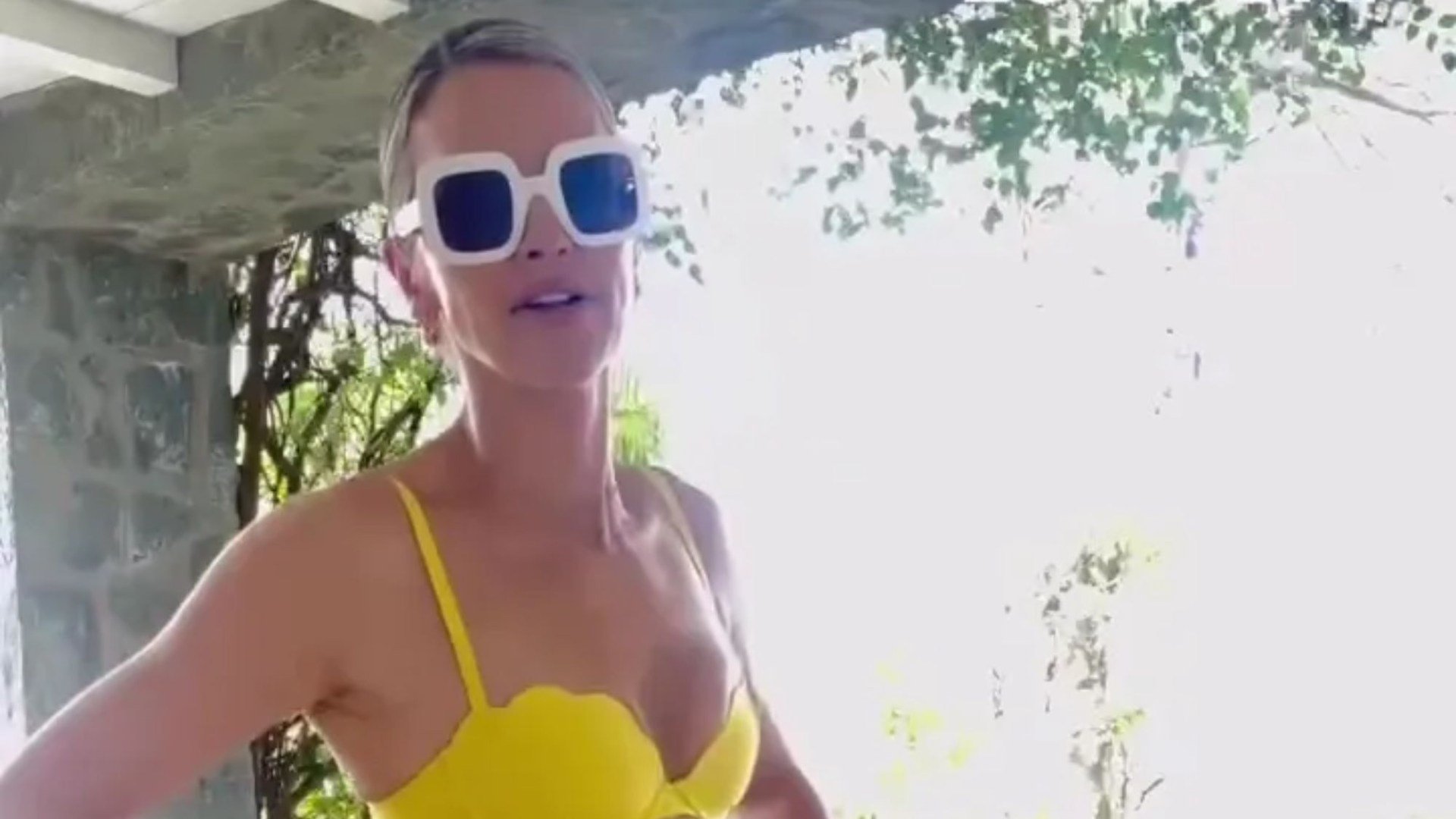 Vogue Williams stuns in as she shows off her tan in yellow bikini on holiday