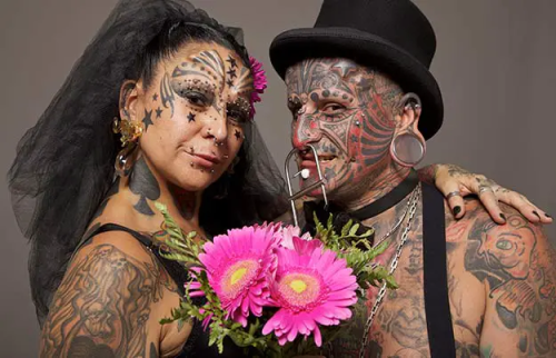Guinness World Records: Most body modifications (married couple ...