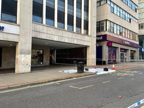 Evidence marker spotted at city centre murder scene as area remains sealed off