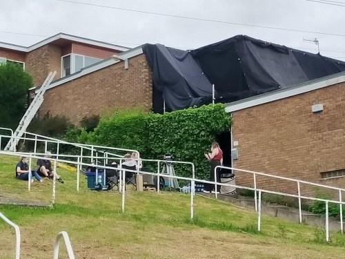 Blackout curtain draped over Gleadless Valley house on second day of shooting for The Full Monty
