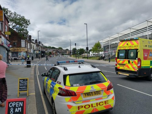 Man arrested on suspicion of threats to kill after being brought down from Sheffield roof