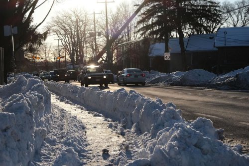 Other GTA cities remove snow piled in every driveway by plows. Could Toronto do the same across the city?