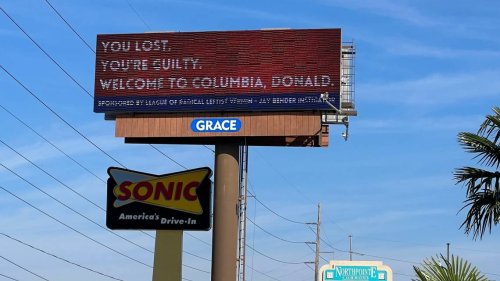 As Trump visits Carolina-Clemson game, billboards taunting him await. Here’s what they say