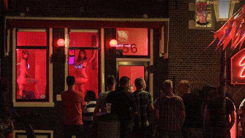 Inside Amsterdam’s seedy red light district where Brits flock for sex at 11 AM despite officials saying: ‘Stay Away!’