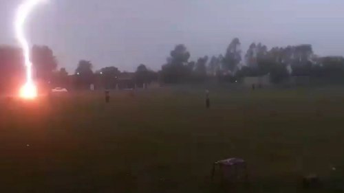 Terrifying moment THREE 300million volt lightning bolts strike football pitch in horror hat-trick during match