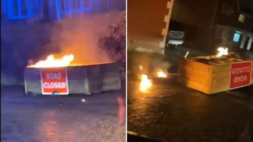 Moment barricades burn as they are set on fire just hours after being installed to improve road plagued with traffic
