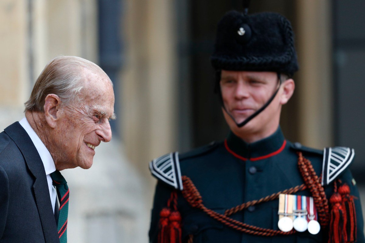 Prince Philip cheekily jokes with soldier about his weight as he returns to work