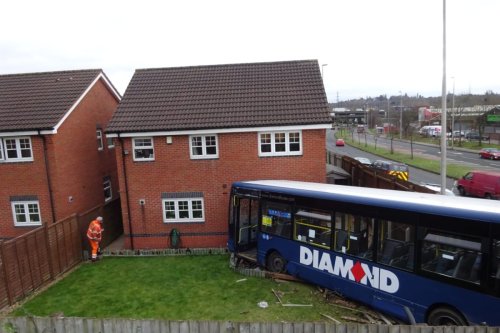 Couple saved by having a lie-in when a bus smashed into their home