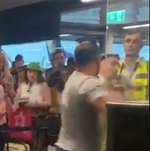 Shocking moment man knocks out two airport workers in front of girlfriend after being threatened with being “filled in”