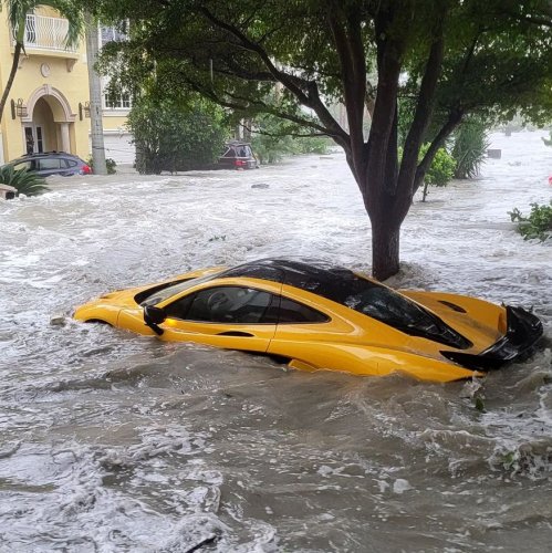 Watch as $1million McLaren hypercar is washed away by Hurricane Ian as streets turn to rivers in ‘apocalyptic’ storm