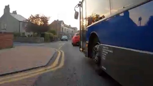 Watch as ‘bully’ bus driver narrowly overtakes furious cyclist on busy high street – but who’s in the right?