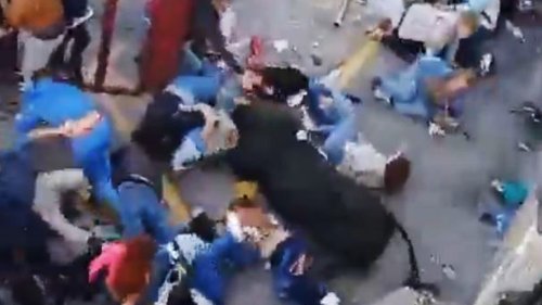 Shocking moment raging BULL crashes into children at Easter festival after bursting through barrier as crowd is fleeing
