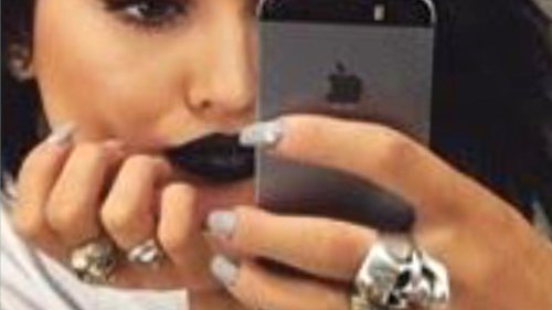 Kylie Jenner shows off her SHAVED head and looks unrecognizable with black lipstick & skull rings in throwback photos