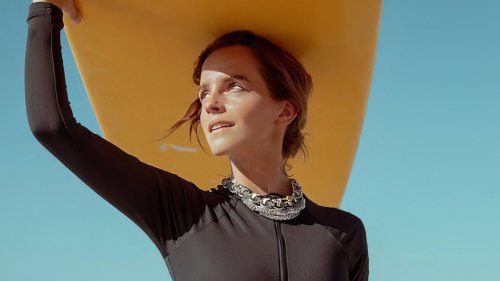 Emma Watson shows off her incredible figure in a cut-out black wetsuit ...