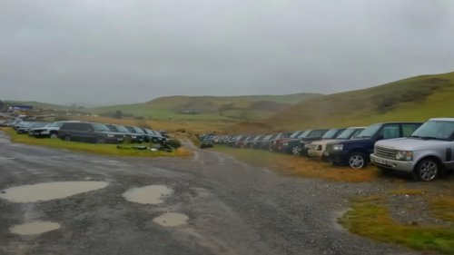 Inside incredible abandoned Range Rover graveyard with hundreds of the luxury 4x4s left to rot on a Welsh hillside
