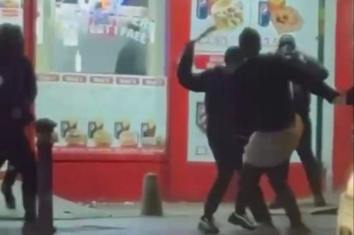 Moment yobs brawl with huge MACHETES outside Premier League stadium as terrified punters watch in horror