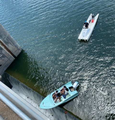Shock pic shows boat full of revelers perched on the edge of 36ft drop