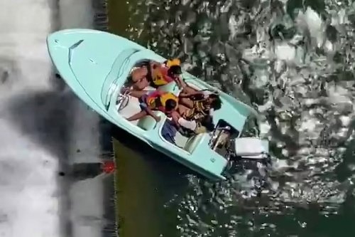 Shock pic shows boat full of revelers perched on the edge of 36ft drop