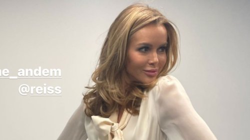 BGT’s Amanda Holden flashes tanned legs in thigh-split skirt as she spins around on an office chair