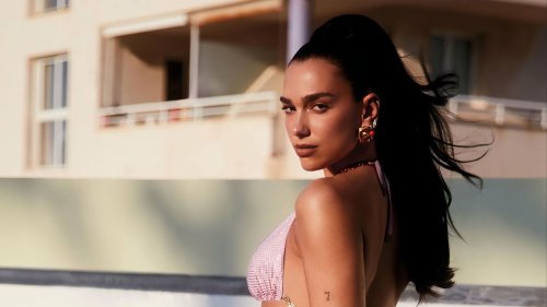 Dua Lipa shows off stunning physique as she wows in sparkling pink swimsuit from her new line with Versace