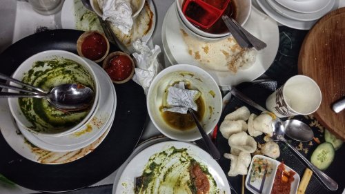 Why Waiters Actually Hate When You Stack Your Plates At A Restaurant