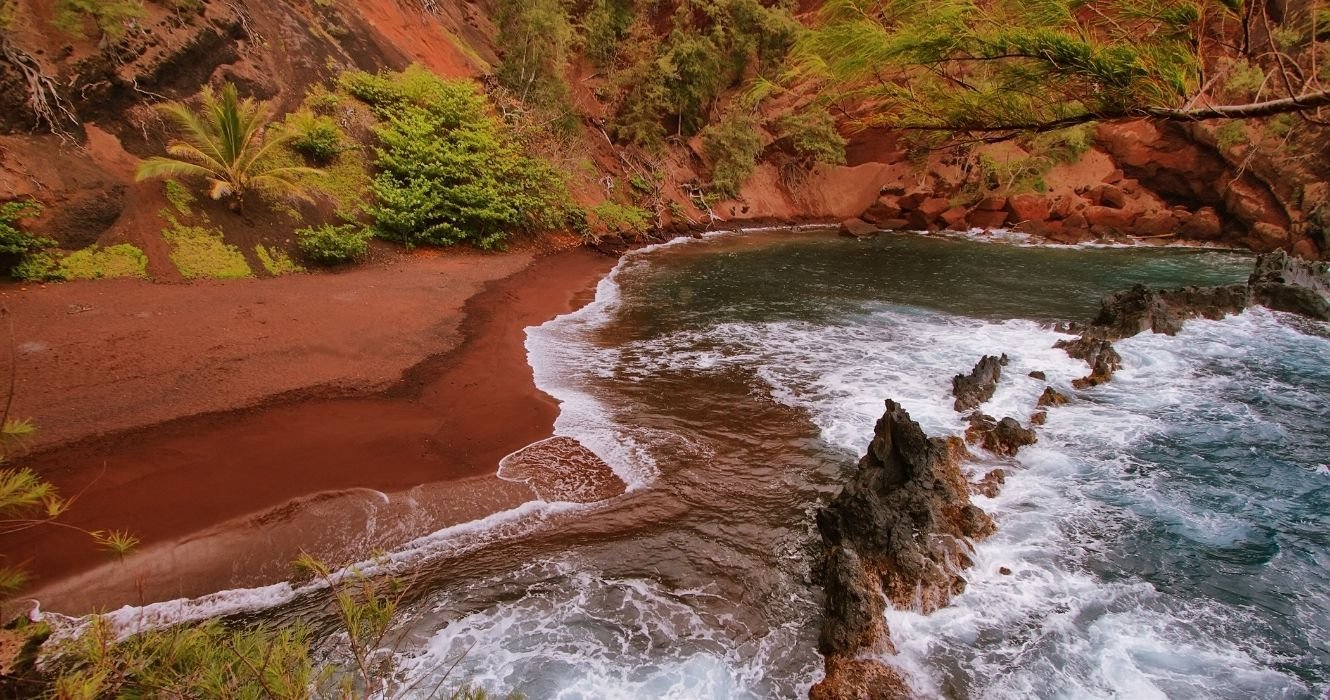 Does Hawaii Have A Pink Sand Beach? No, But It Does Have One With Red Sands