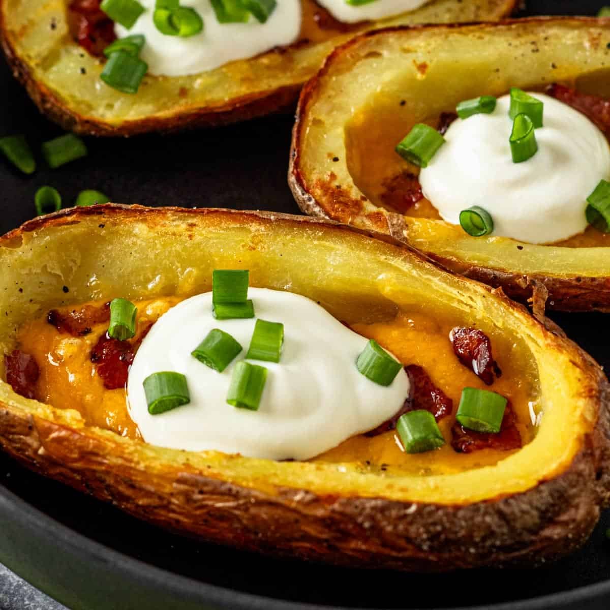 Air Fryer Potato Skins With Cheese and Bacon - The Yummy Bowl