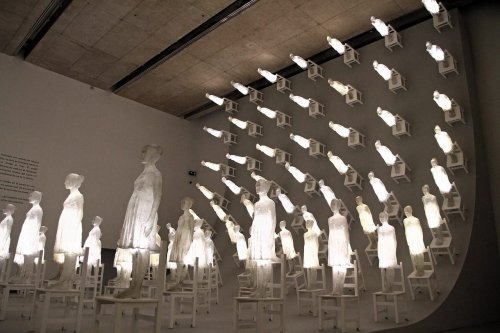 A Massive Wave of Luminous Figures Scales a Dark Wall in Ataraxia by Eugenio Cuttica — Colossal