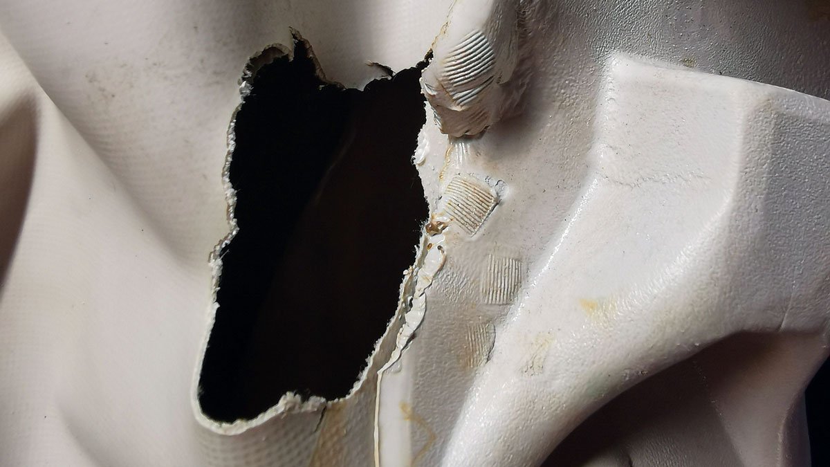 Repairing an inflatable dinghy: fixing holes