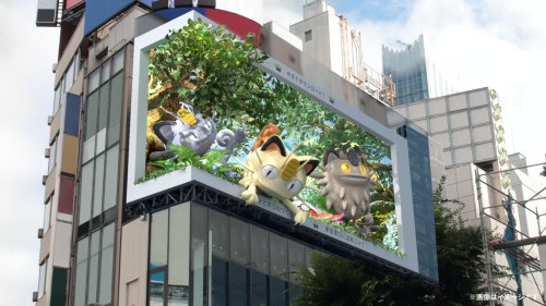 Giant 3D cat Pokémon are appearing on this digital billboard in Shinjuku
