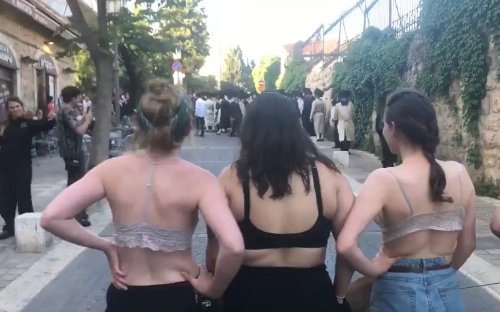 Jerusalem Haredi protesters flee after women strip down to bras