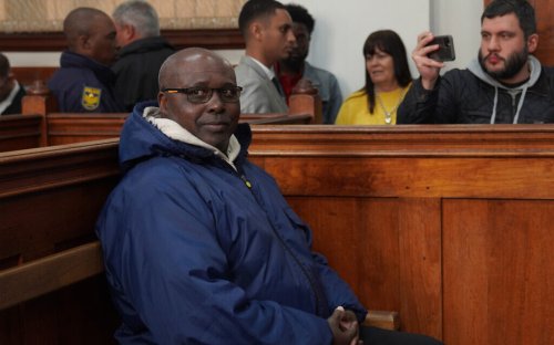 Suspect in Rwanda genocide church massacre appears in court holding Bible