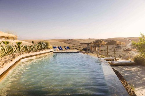 This New Glamping Hotel in the Moroccan Desert Has Outdoor Pools, 20 Luxe Tents, and Camels to Ride
