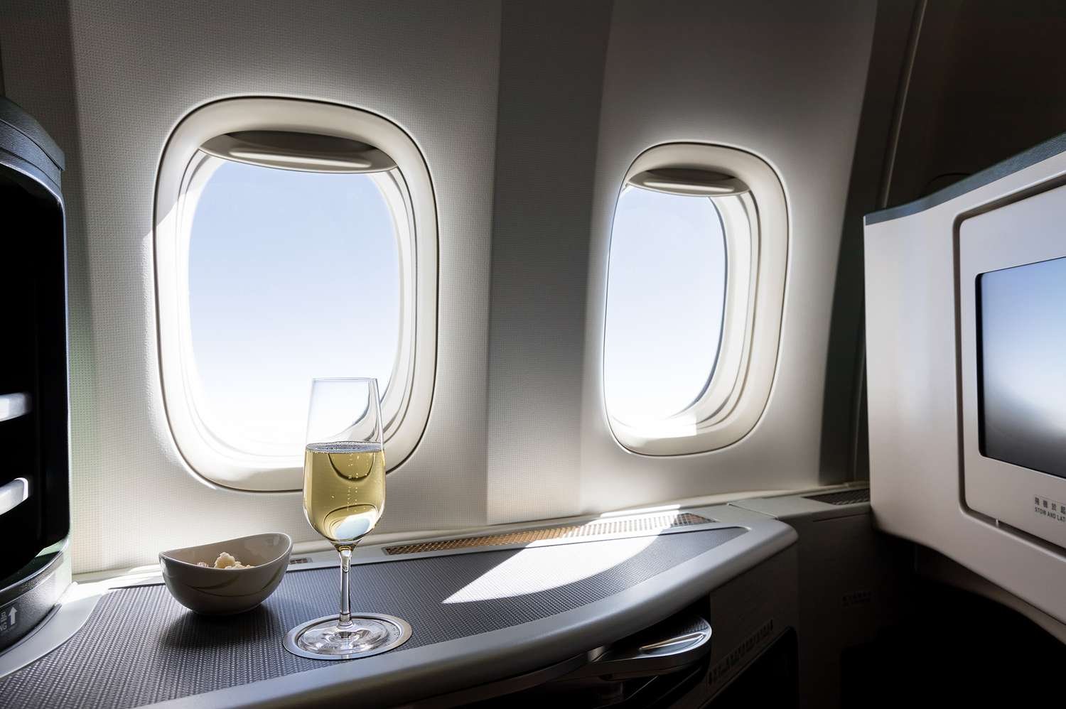 We Asked 4 Travel Experts the Best Ways to Get a Flight Upgrade—These Are Their Tried and Tested Strategies