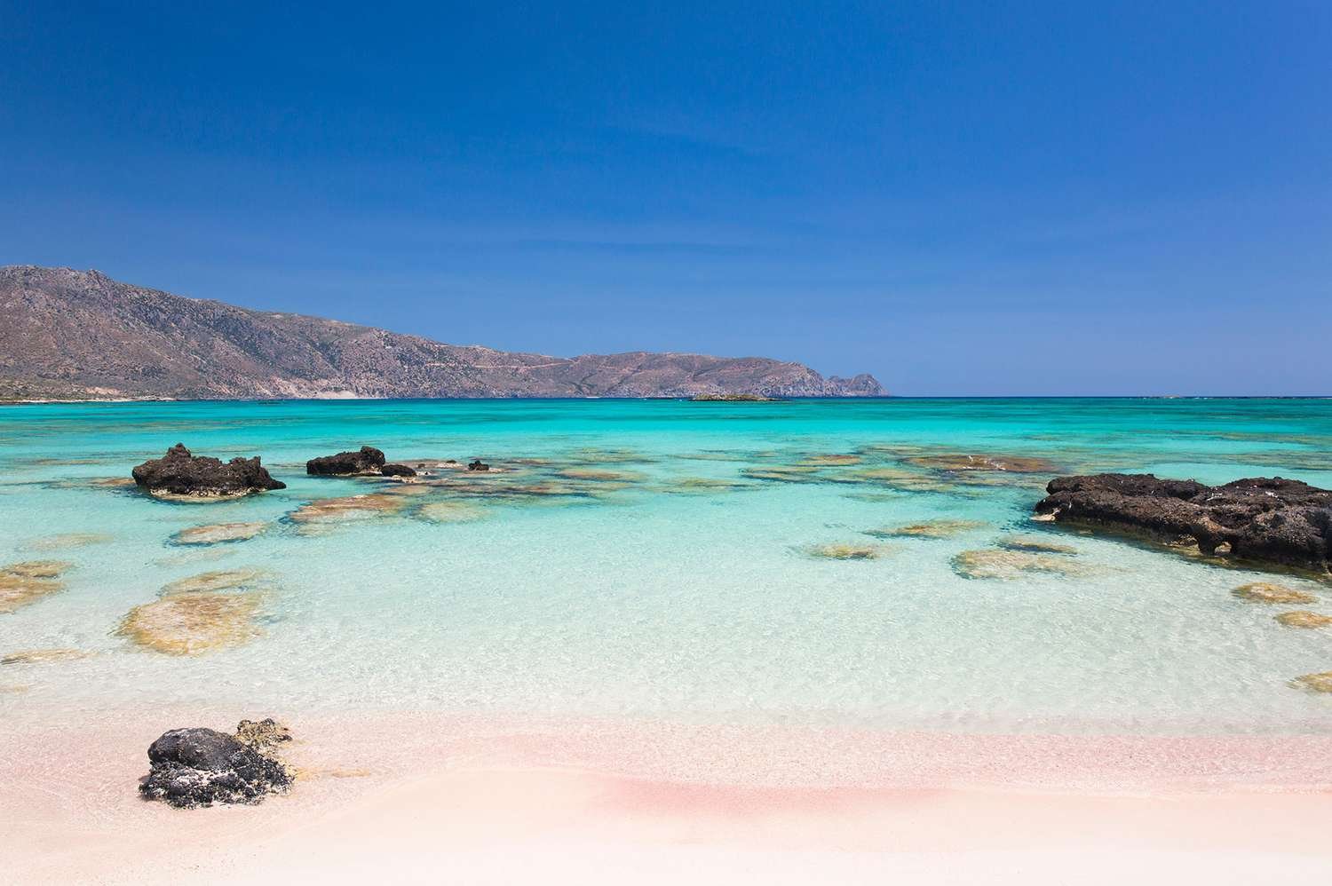 This Beach Was Named No. 1 in Europe—and It Has Pink Sand, Crystal-clear Turquoise Water, and a Lagoon You Can Walk Thro