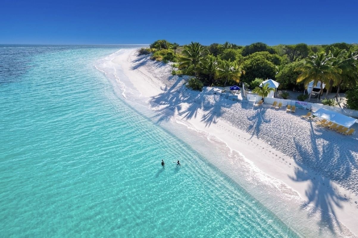 This English-Speaking Caribbean Island With 33 White Sand Beaches, 82°F Winters, And $8 Beach BBQ Is Breaking Tourism Re