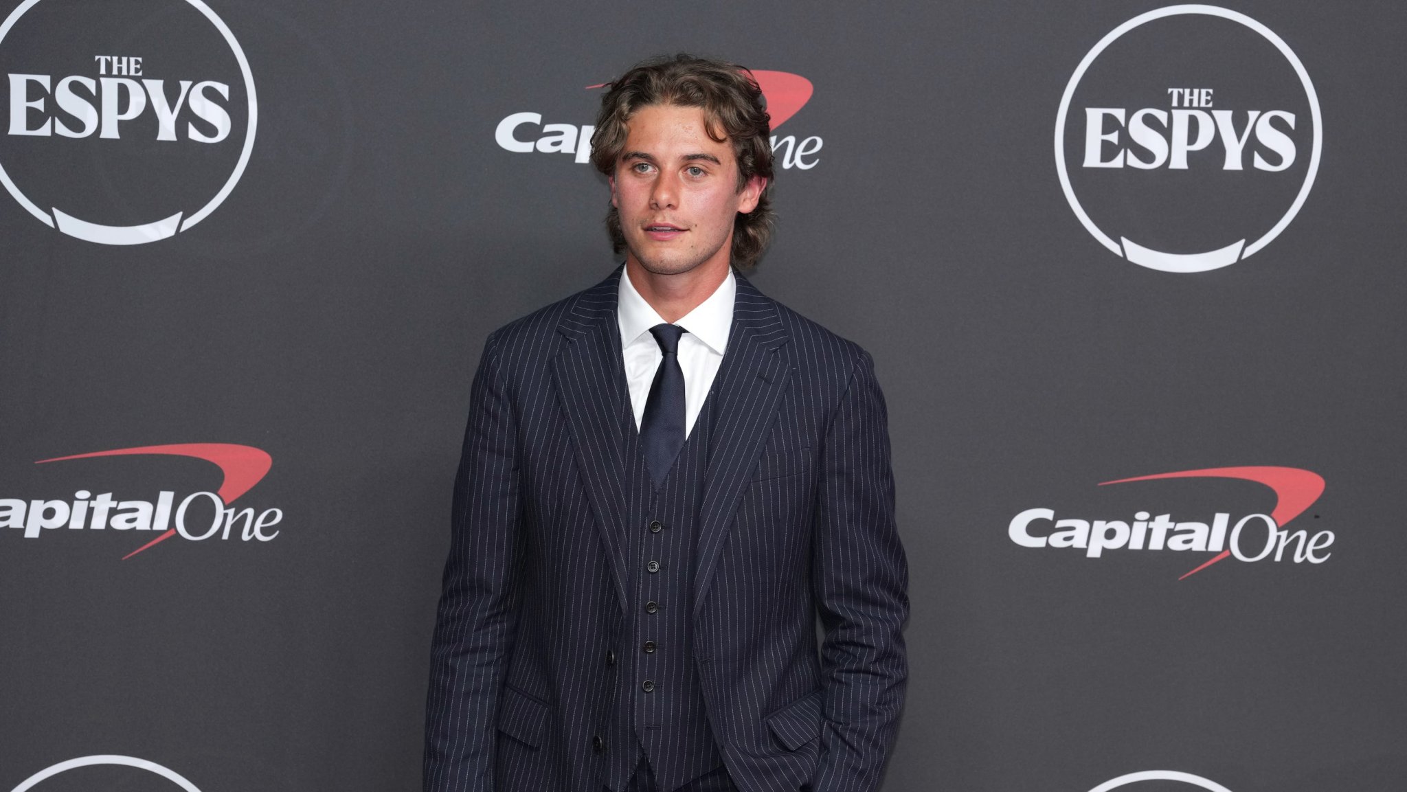 Olympic hero Jack Hughes reveals why he wore a three-piece suit in a heatwave